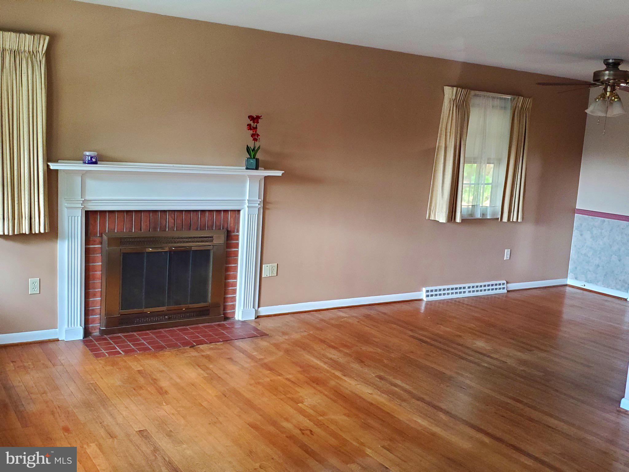 3010 Curtis Road Reading, PA 19608 - Photo 3 of 14 an empty room with windows and fireplace