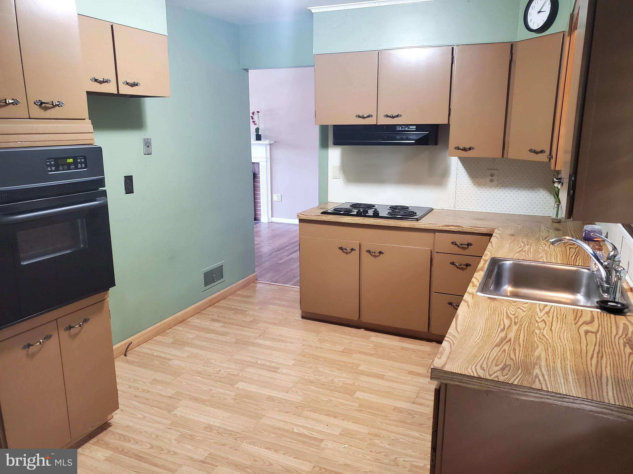 3010 Curtis Road Reading, PA 19608 - Photo 6 of 14 a kitchen with a stove and a refrigerator