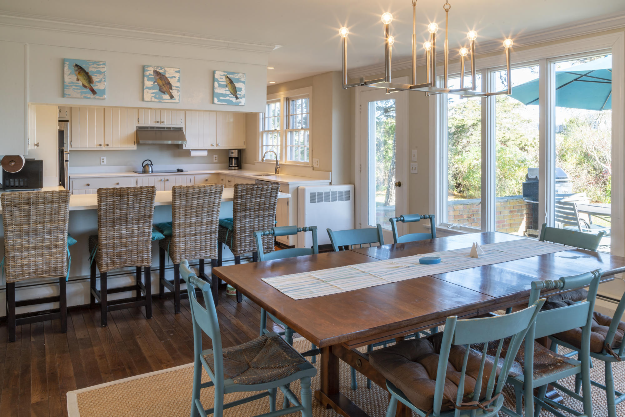 132 Old Salt Works Road Chatham, MA 02633 - Photo 11 of 34 a view of a dining room with furniture window and wooden floor