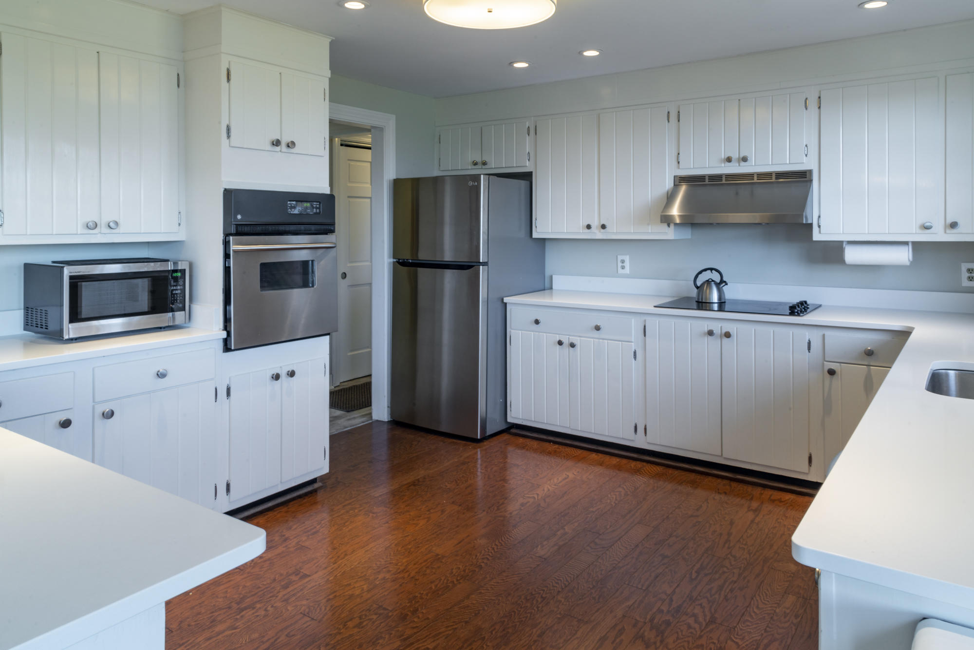 132 Old Salt Works Road Chatham, MA 02633 - Photo 14 of 34 a kitchen with stainless steel appliances a refrigerator sink and microwave
