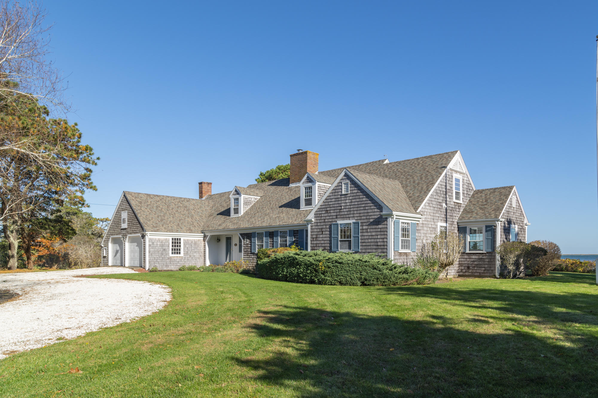 132 Old Salt Works Road Chatham, MA 02633 - Photo 2 of 34 a view of a house with a big yard plants and large trees