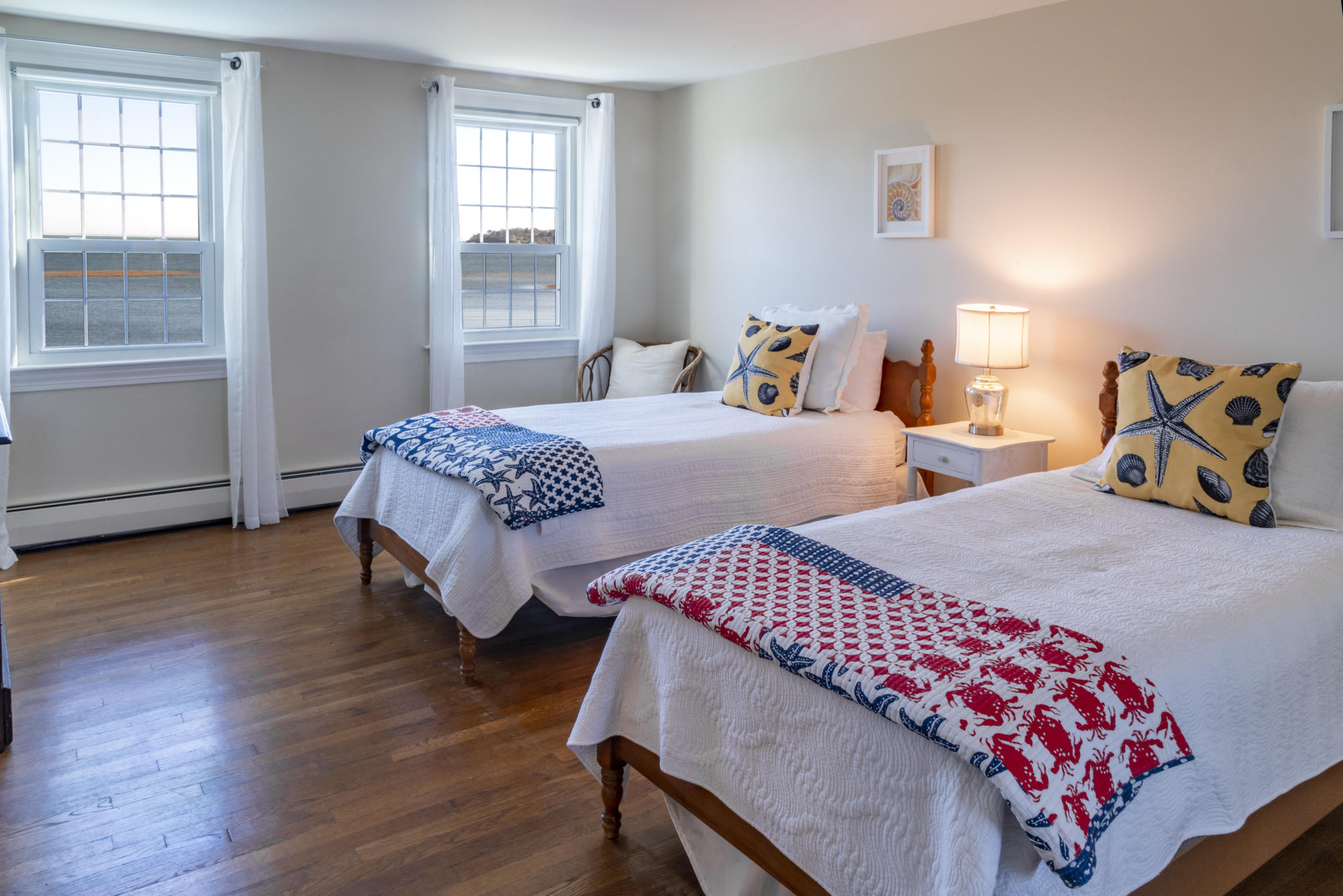 132 Old Salt Works Road Chatham, MA 02633 - Photo 23 of 34 a bedroom with two beds and wooden floor