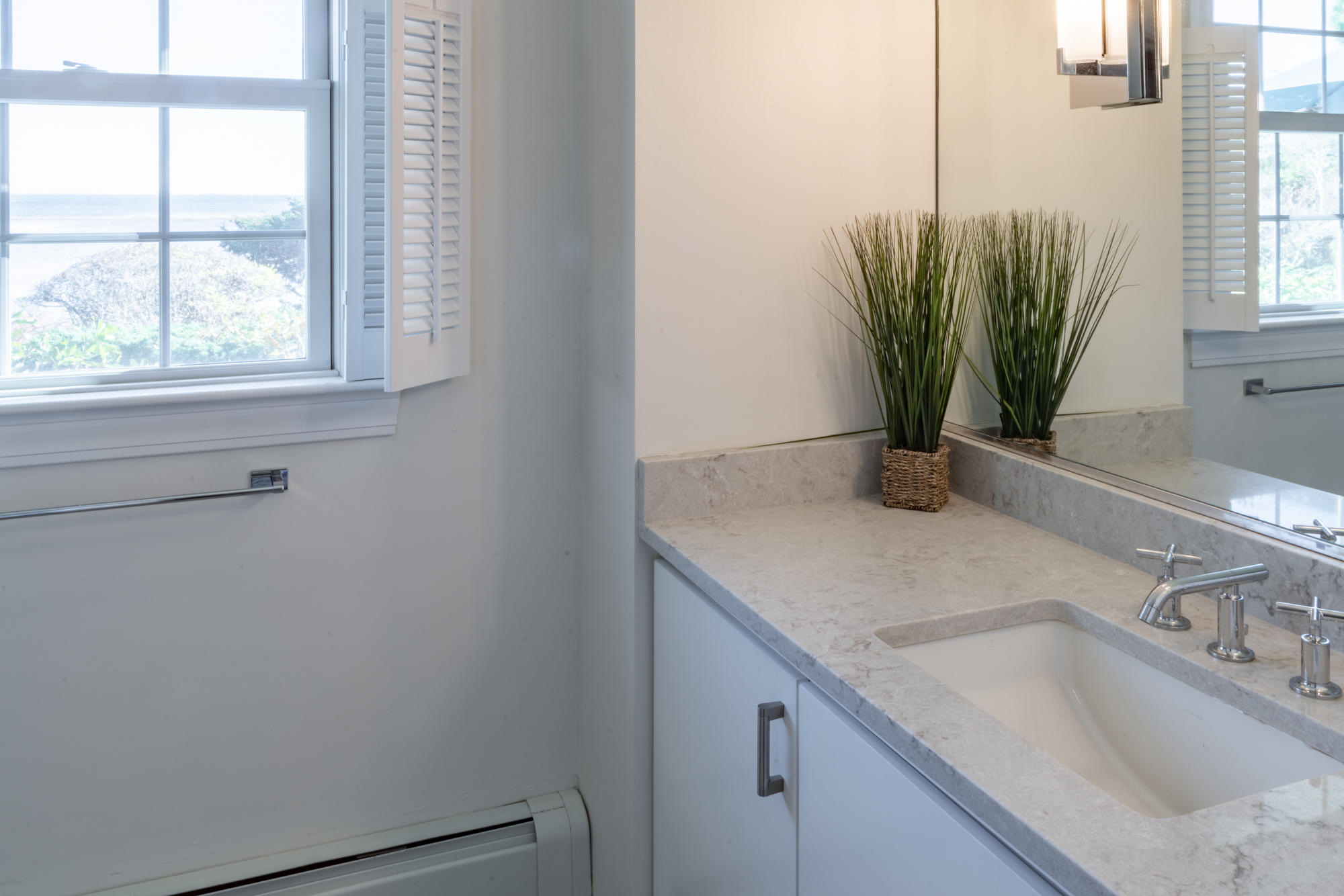 132 Old Salt Works Road Chatham, MA 02633 - Photo 28 of 34 a bathroom with a granite countertop sink a potted plant and a window
