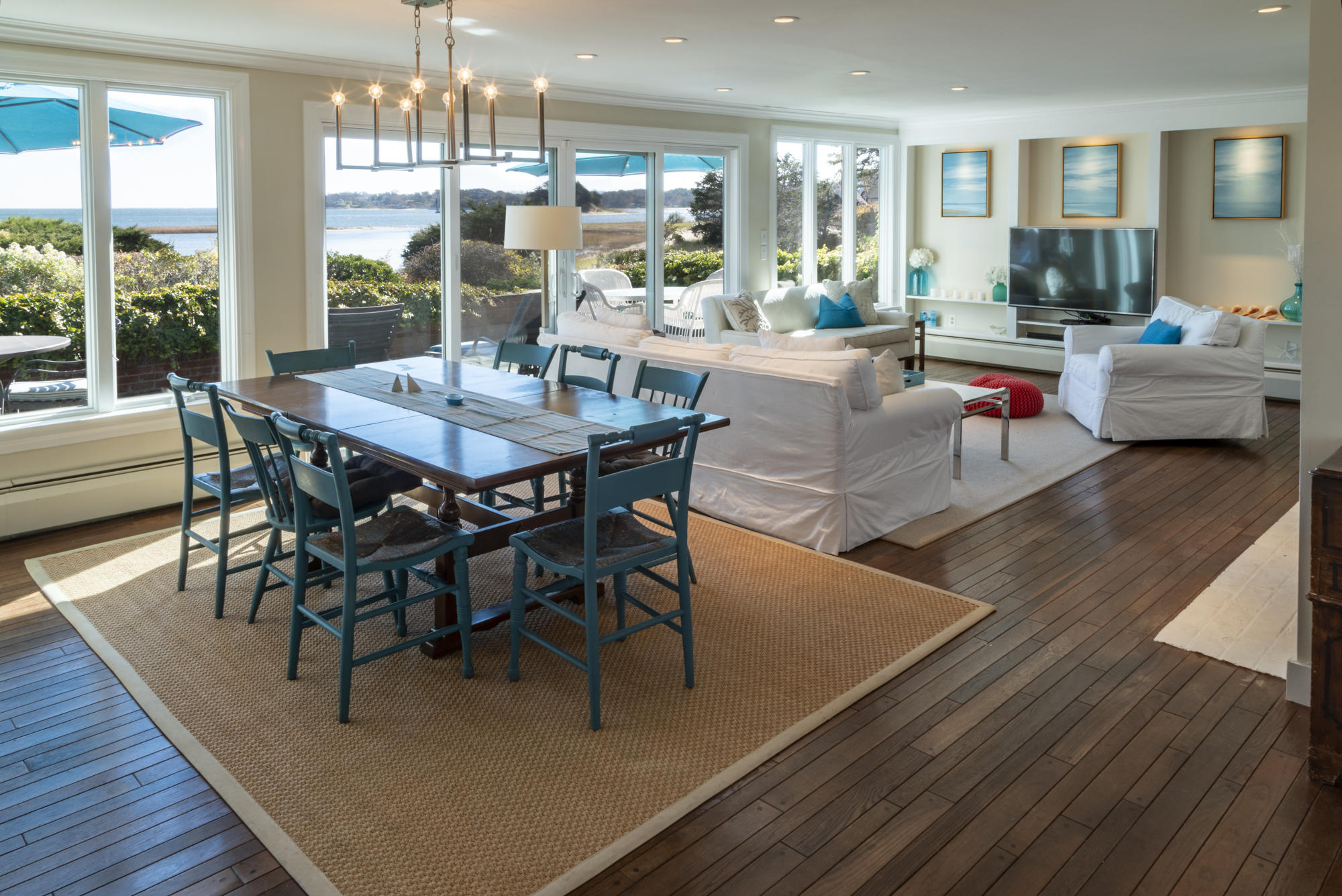 132 Old Salt Works Road Chatham, MA 02633 - Photo 5 of 34 a view of a dining room with furniture wooden floor and chandelier