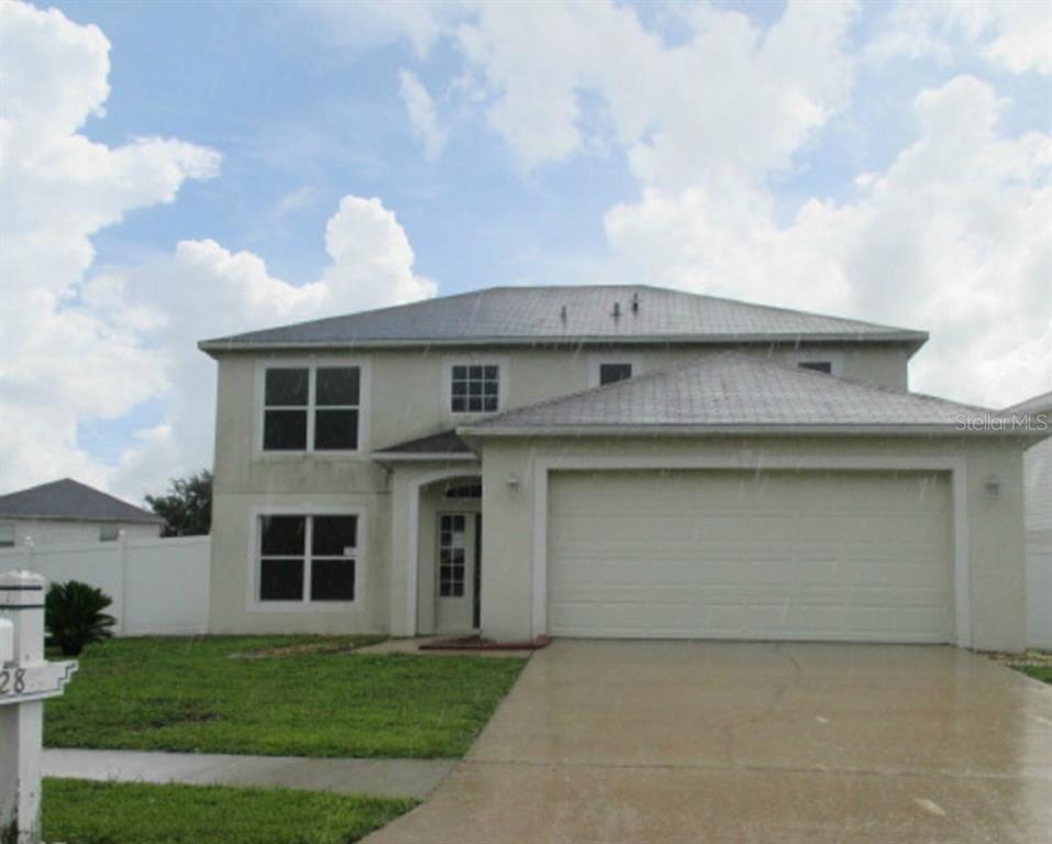 24828 Ravello Street Land O Lakes, FL 34639 - Photo 1 of 1 a front view of house with yard