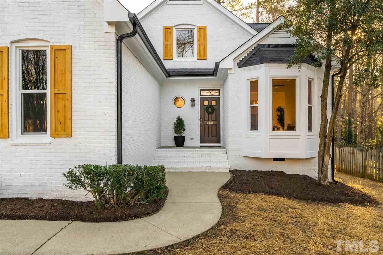 608 Hardimont Road Raleigh, NC 27609 - Photo 2 of 29 a view of a white house with large windows