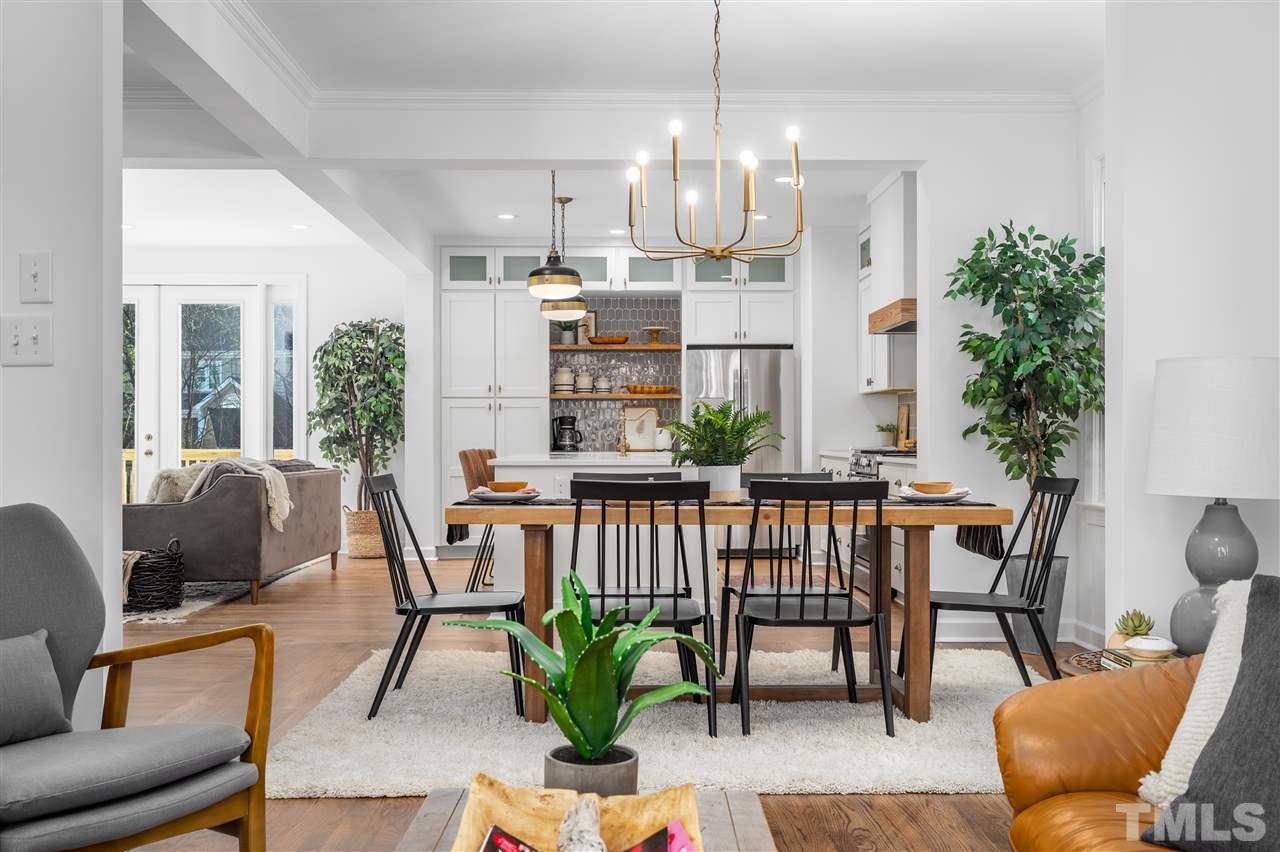 608 Hardimont Road Raleigh, NC 27609 - Photo 11 of 29 a view of a dining room with furniture window and wooden floor