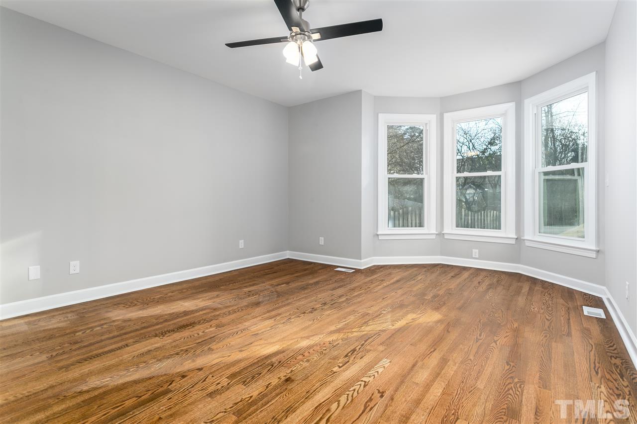 608 Hardimont Road Raleigh, NC 27609 - Photo 18 of 29 a view of an empty room with wooden floor and a window