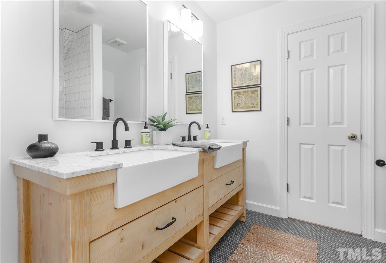 608 Hardimont Road Raleigh, NC 27609 - Photo 19 of 29 a bathroom with a double vanity sink mirror and