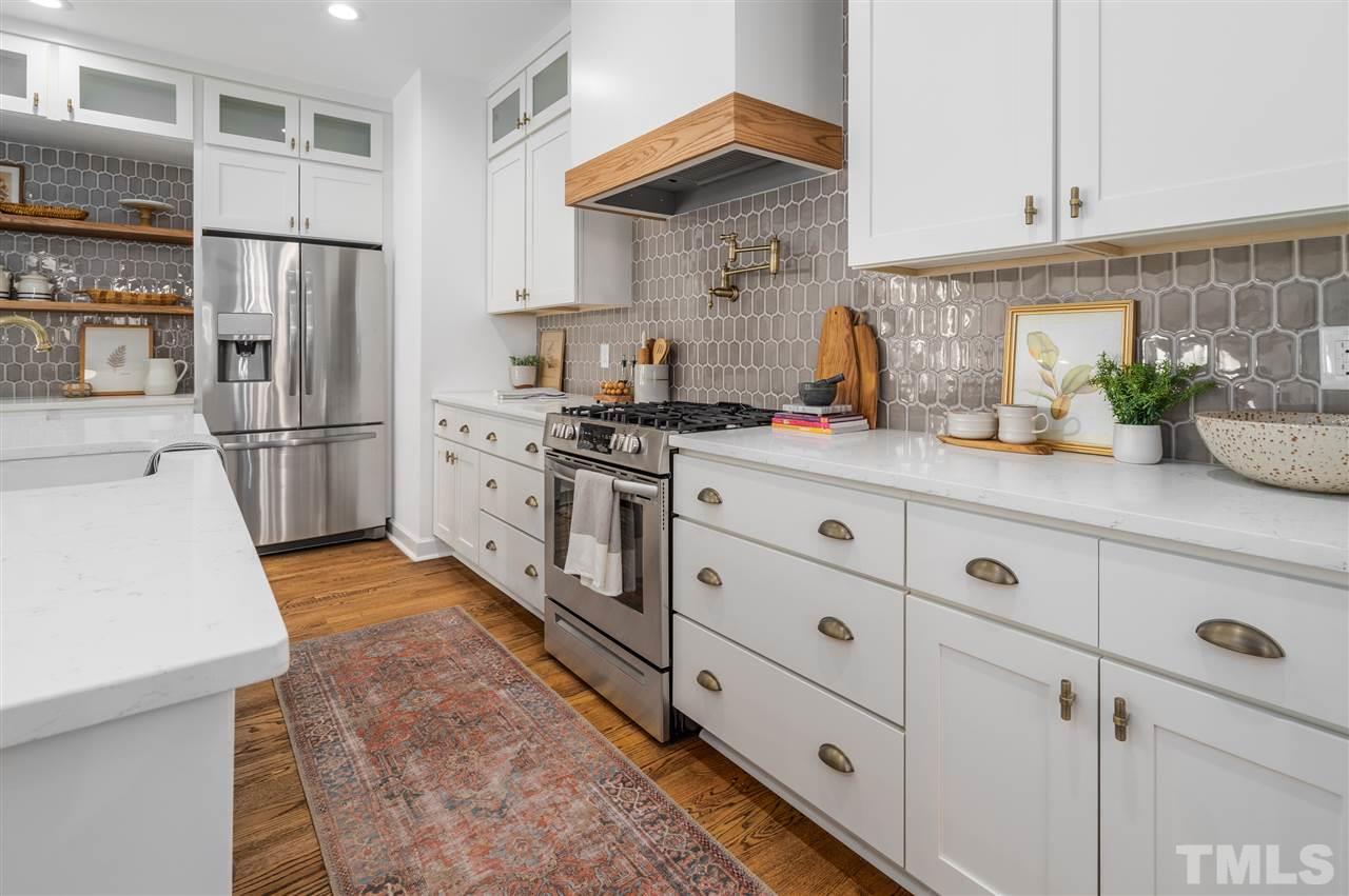 608 Hardimont Road Raleigh, NC 27609 - Photo 7 of 29 a kitchen with stainless steel appliances a refrigerator sink and cabinets
