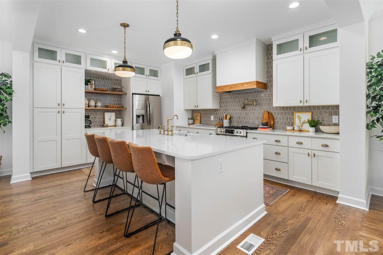 608 Hardimont Road Raleigh, NC 27609 - Photo 8 of 29 a kitchen with a sink cabinets and wooden floor