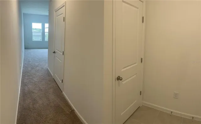 a view of a bathroom from the hallway