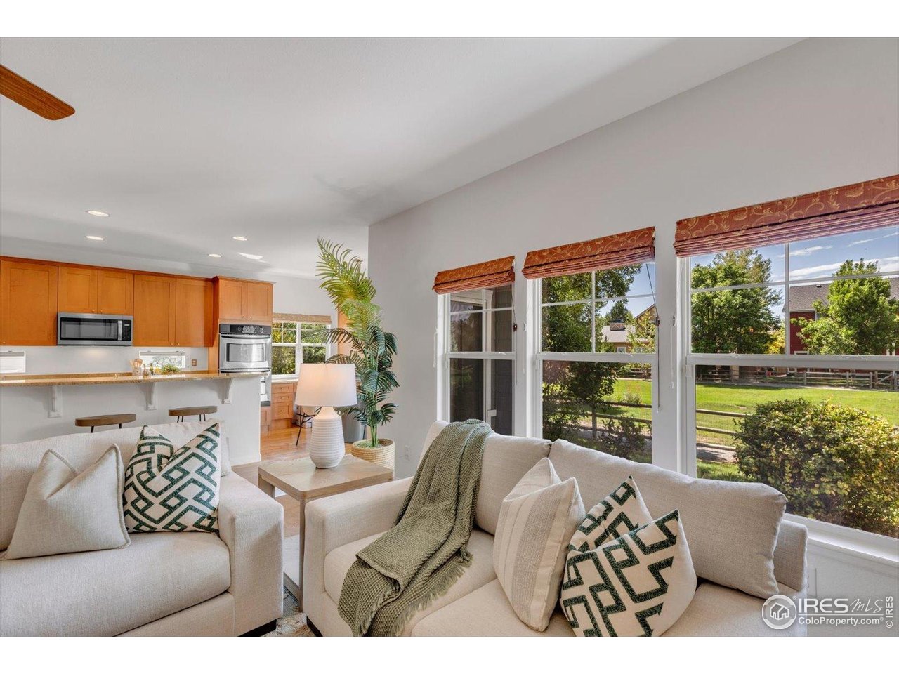 4119 Riley Drive Longmont, CO 80503 - Photo 13 of 47 Living Room overlooks the backyard/park