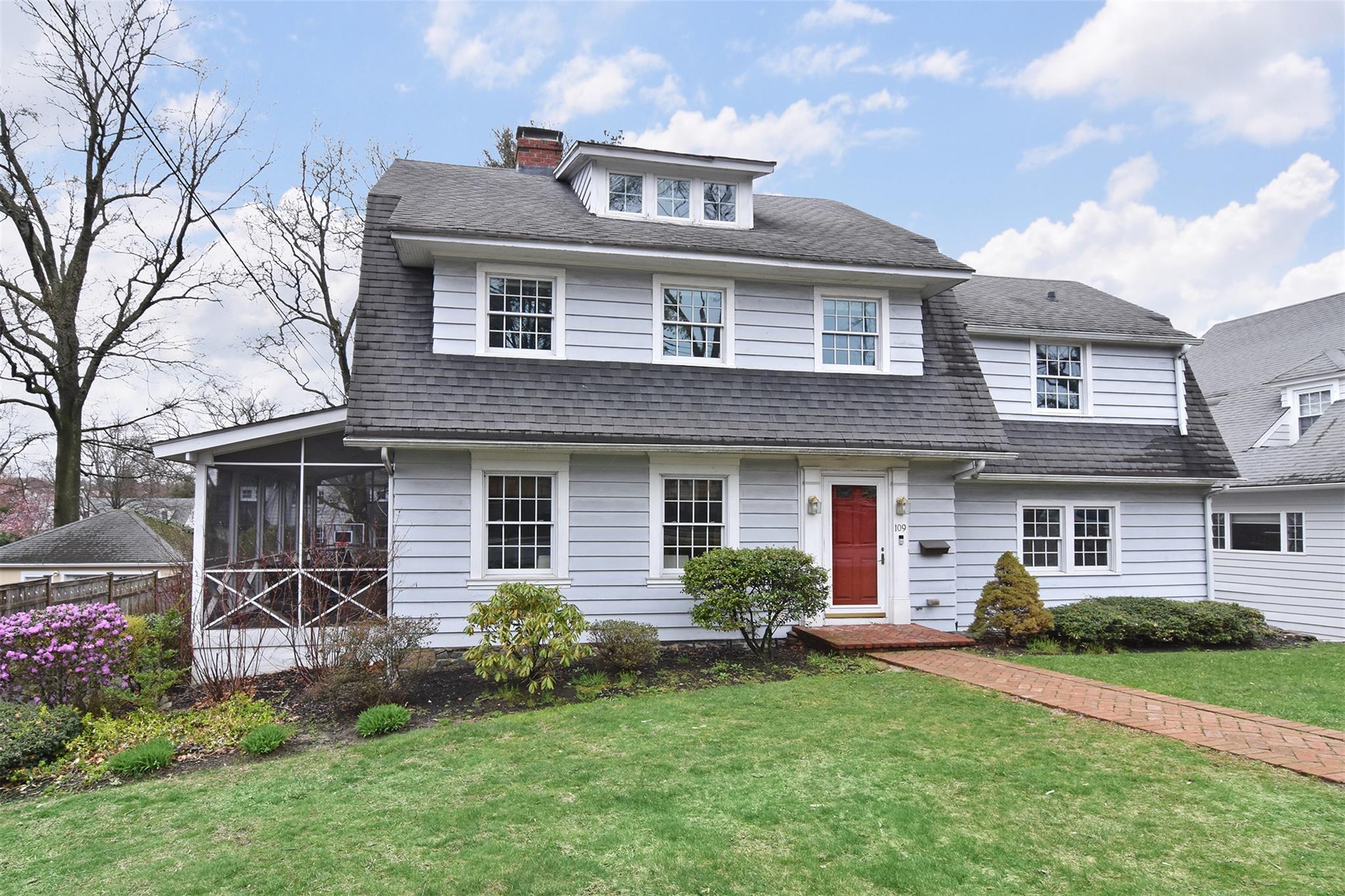 109 Chatfield Road Bronxville, NY 10708 - Photo 1 of 1 a front view of a house with a garden and plants