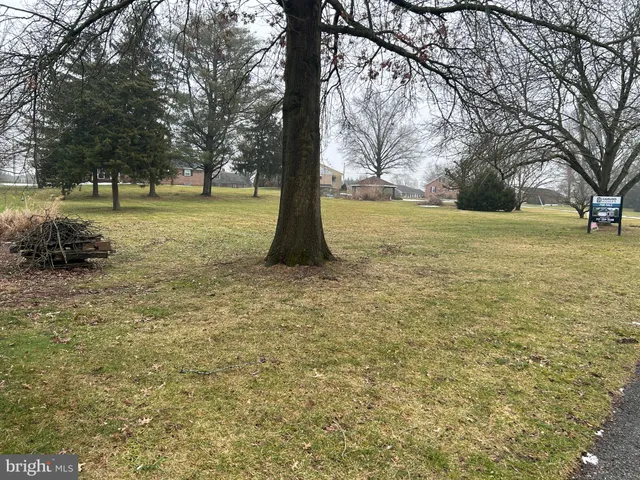 a fire hydrant in the middle of a field