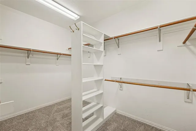 a bathroom with a granite countertop sink mirror and bathtub