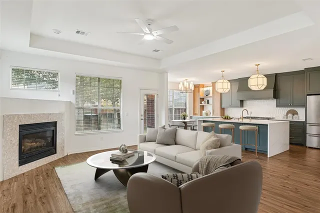 a living room with furniture and fireplace