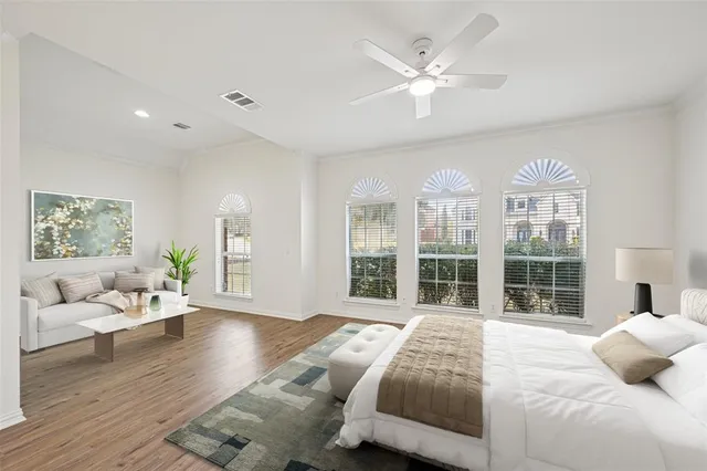 a bedroom with a large bed and a large window