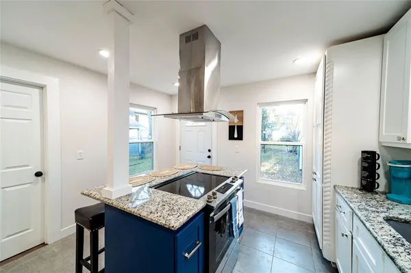 a kitchen with a sink stove and refrigerator