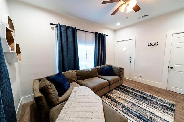 a living room with furniture and a rug