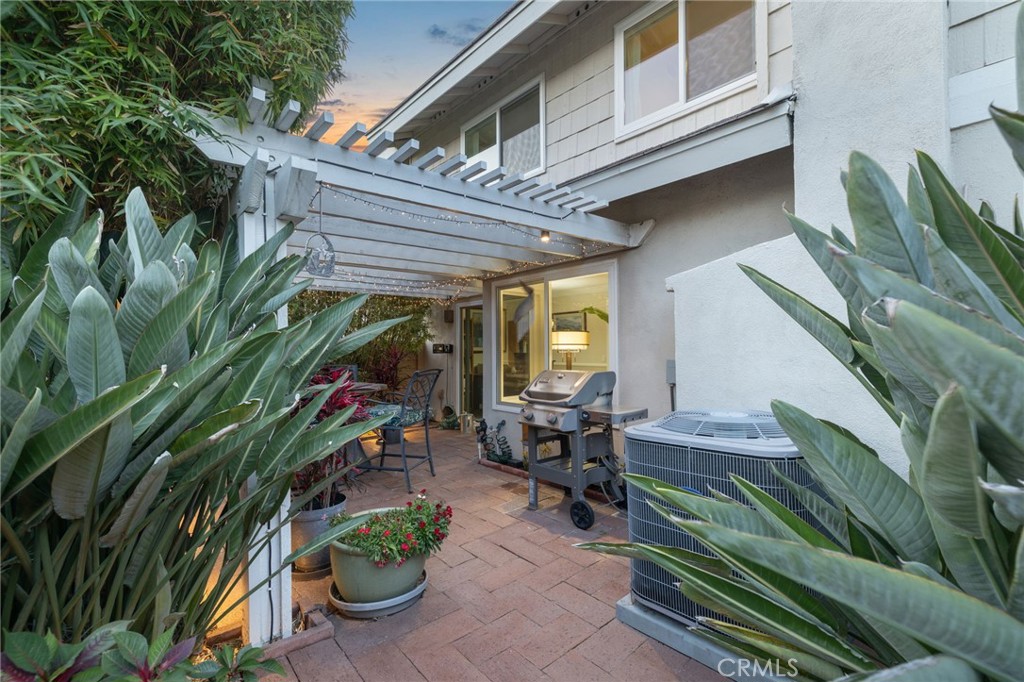 56 Ashbrook Irvine, CA 92604 - Photo 29 of 44 Private Patio Featuring Smart Lighting and Professional Landscaping