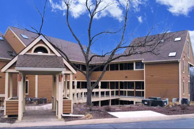 a front view of a house with a garage