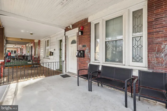 a view of a livingroom with furniture and a window