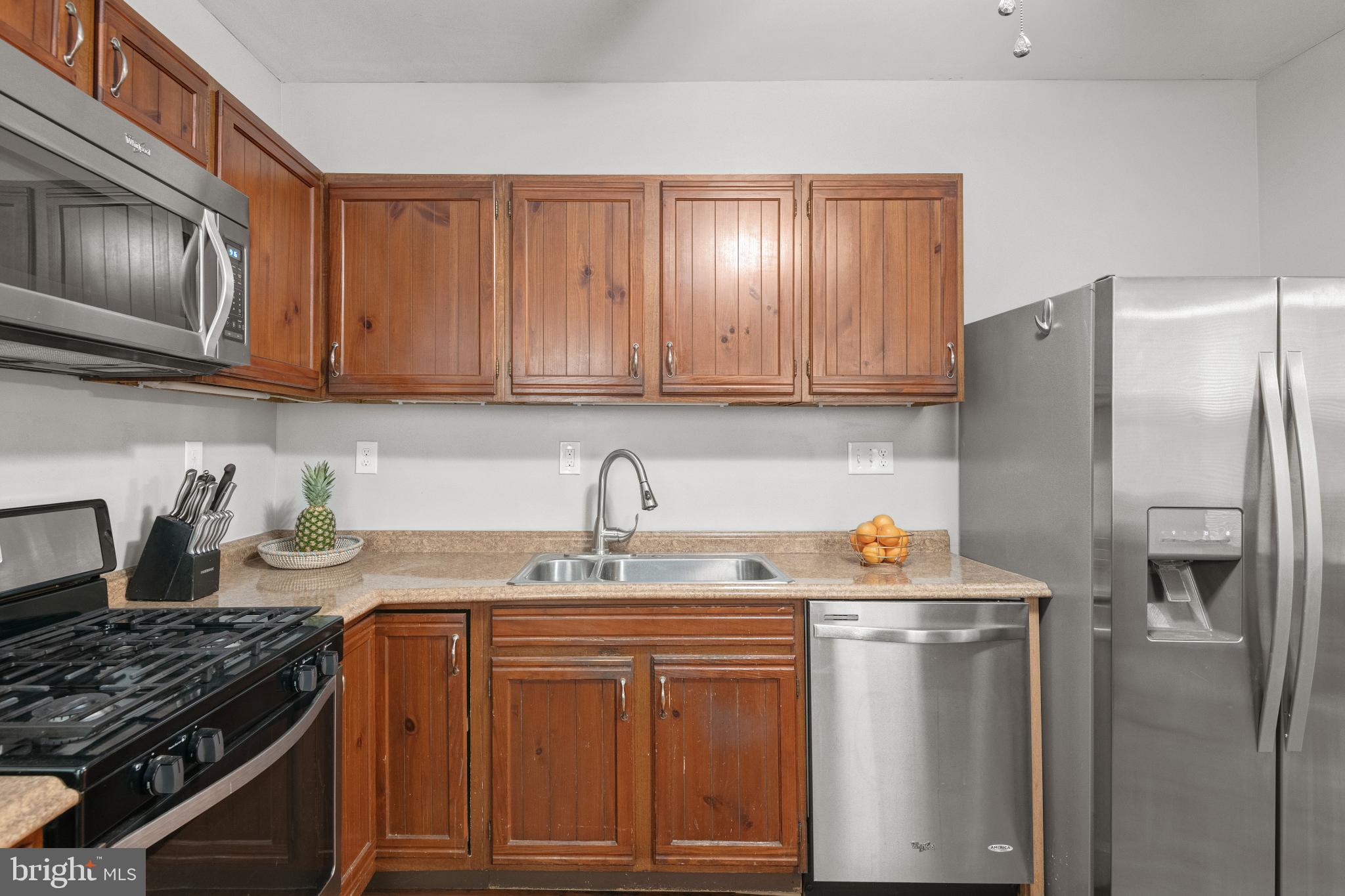 830 North Duke Street Lancaster, PA 17602 - Photo 15 of 41 a kitchen with stainless steel appliances granite countertop a refrigerator stove top oven and sink