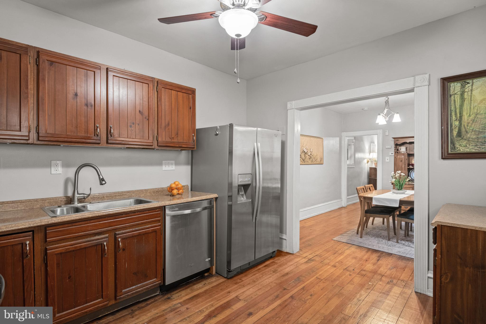 830 North Duke Street Lancaster, PA 17602 - Photo 16 of 41 a kitchen with stainless steel appliances granite countertop a refrigerator a sink dishwasher a stove with wooden cabinets and floor