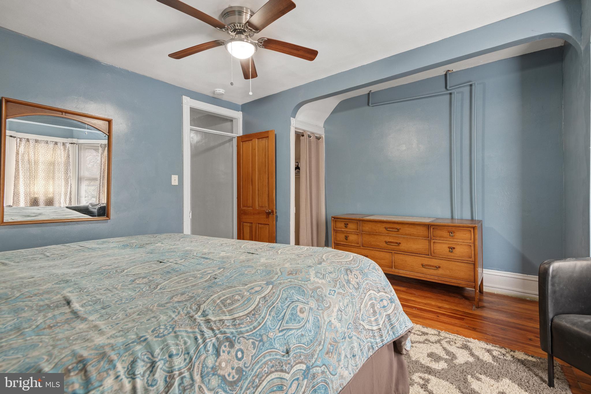 830 North Duke Street Lancaster, PA 17602 - Photo 21 of 41 a bedroom with a bed and a chandelier