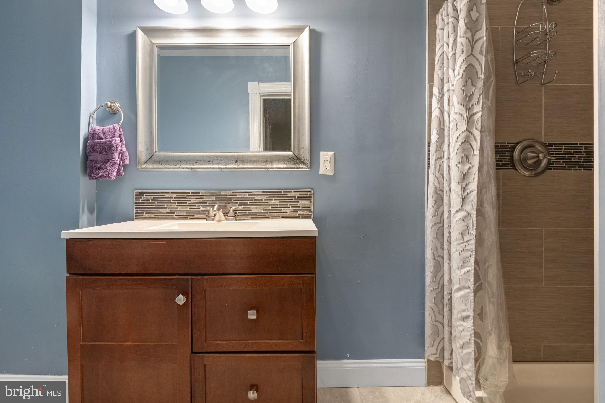 830 North Duke Street Lancaster, PA 17602 - Photo 23 of 41 a bathroom with a sink and a mirror