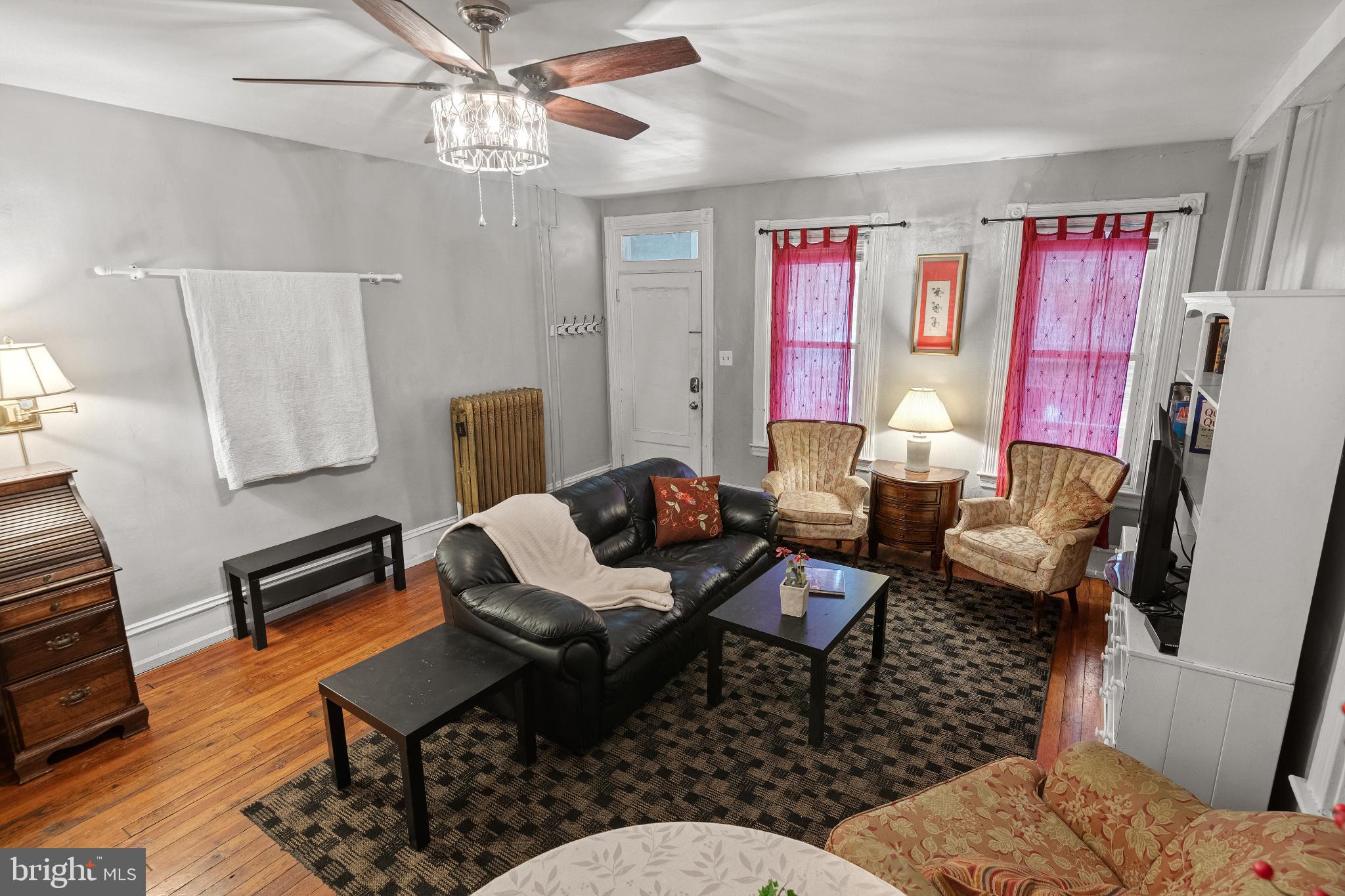 830 North Duke Street Lancaster, PA 17602 - Photo 6 of 41 a living room with furniture a flat screen tv and a window