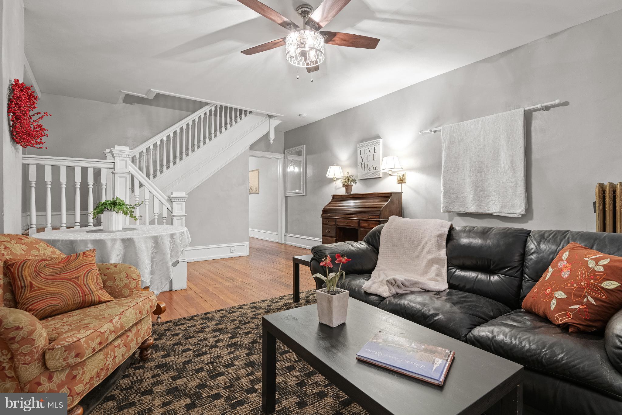 830 North Duke Street Lancaster, PA 17602 - Photo 8 of 41 a living room with furniture and wooden floor