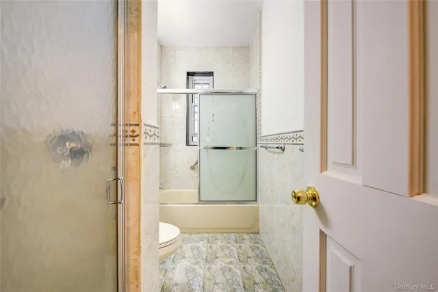 a bathroom with a tub and a shower