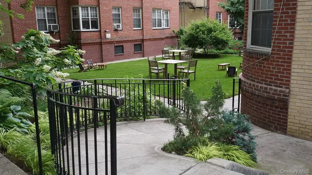 a view of a house with a park iron fence