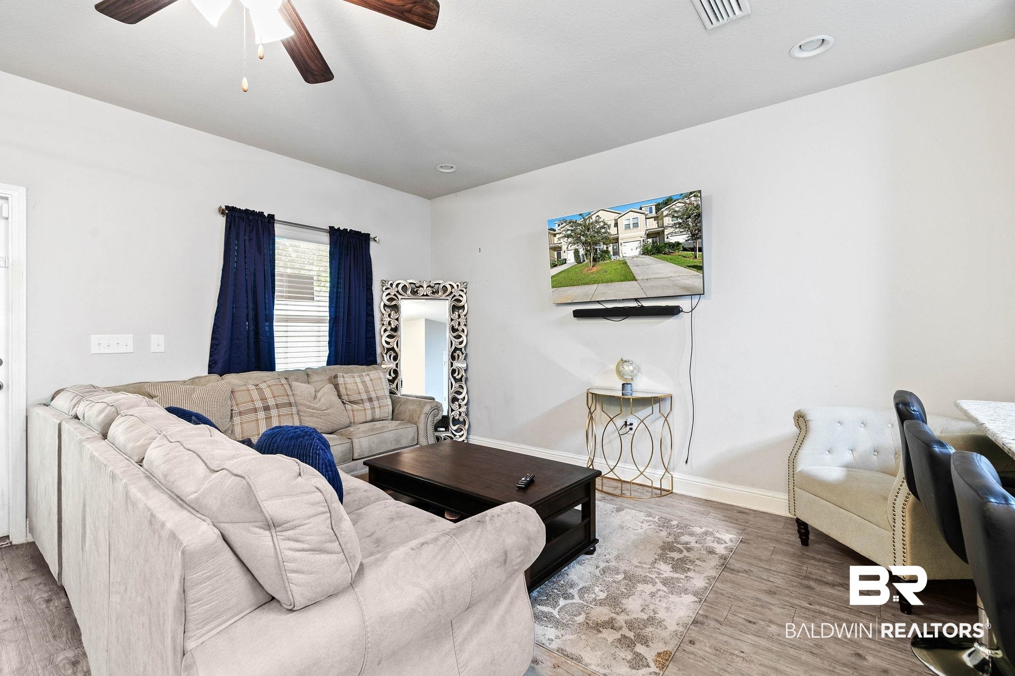 25806 Pollard Road, Unit 24 Daphne, AL 36526 - Photo 7 of 33 Living room featuring wood finished floors and a ceiling fan