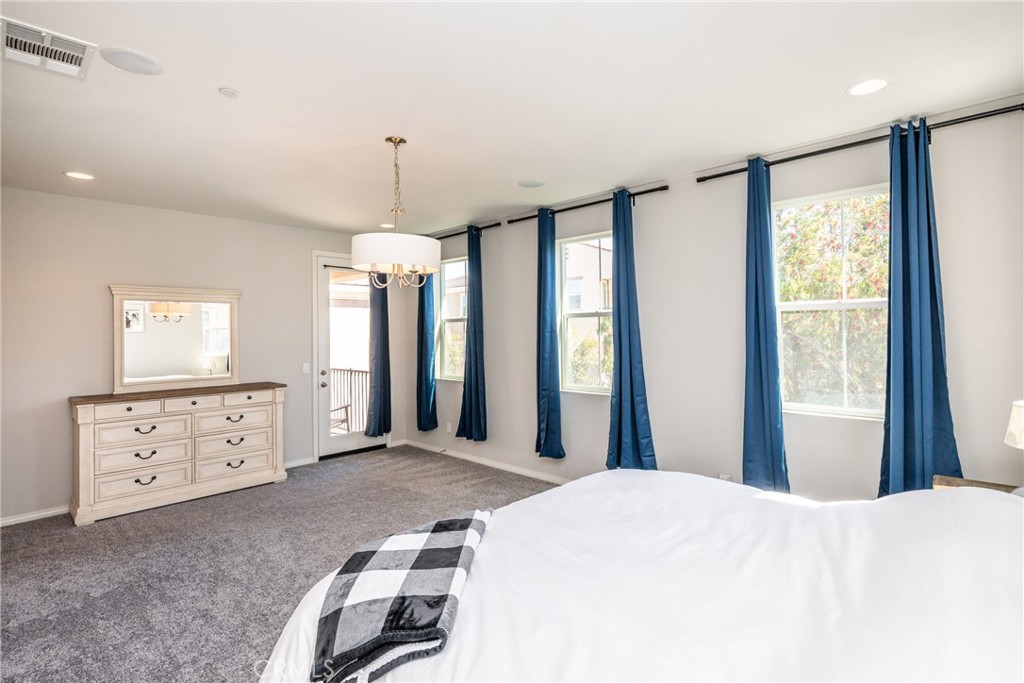 32390 Magee Lane Temecula, CA 92592 - Photo 34 of 75 a bedroom with a bed dresser and a window