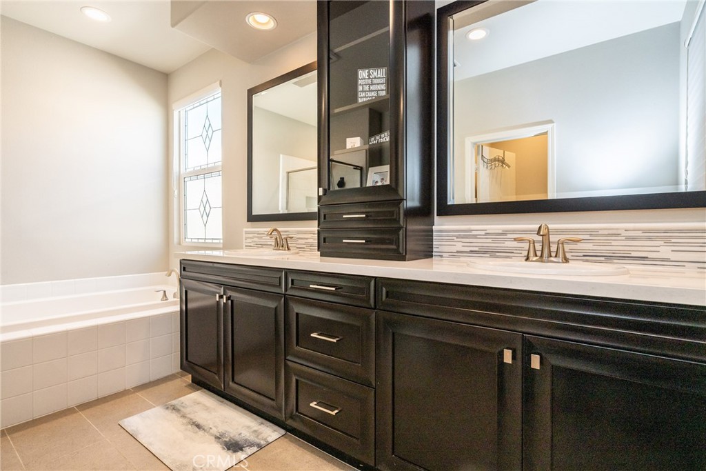 32390 Magee Lane Temecula, CA 92592 - Photo 39 of 75 a bathroom with a sink double vanity and a bathtub