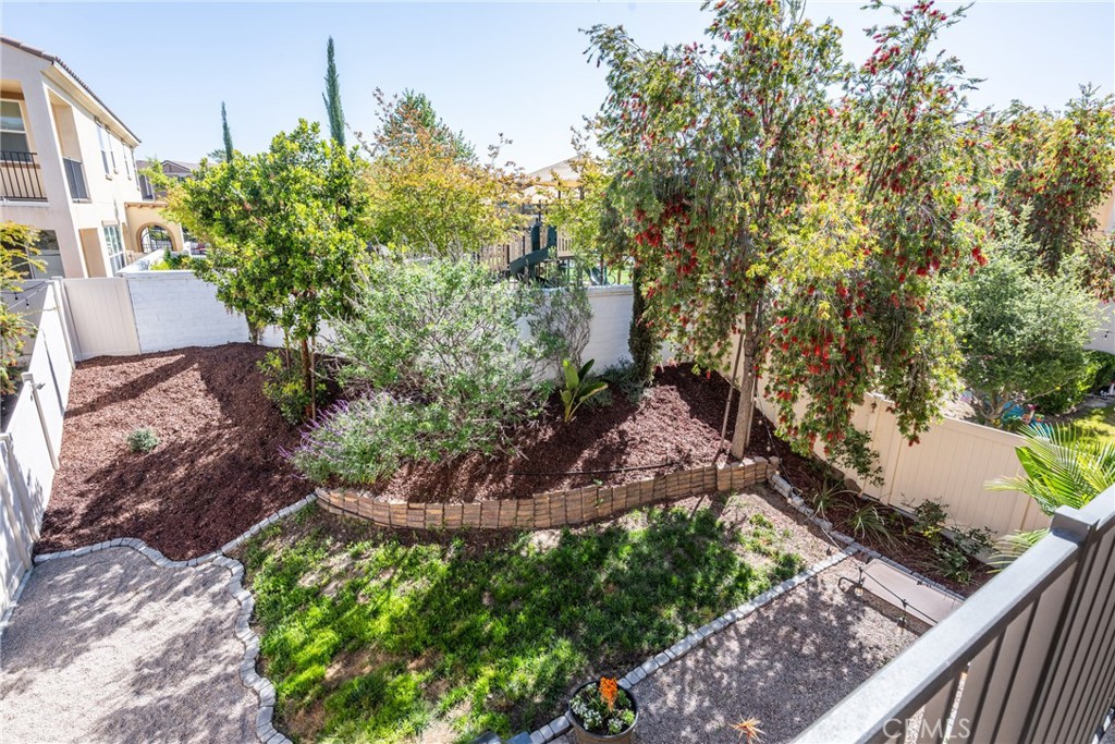 32390 Magee Lane Temecula, CA 92592 - Photo 44 of 75 a view of a garden with plants and a bench