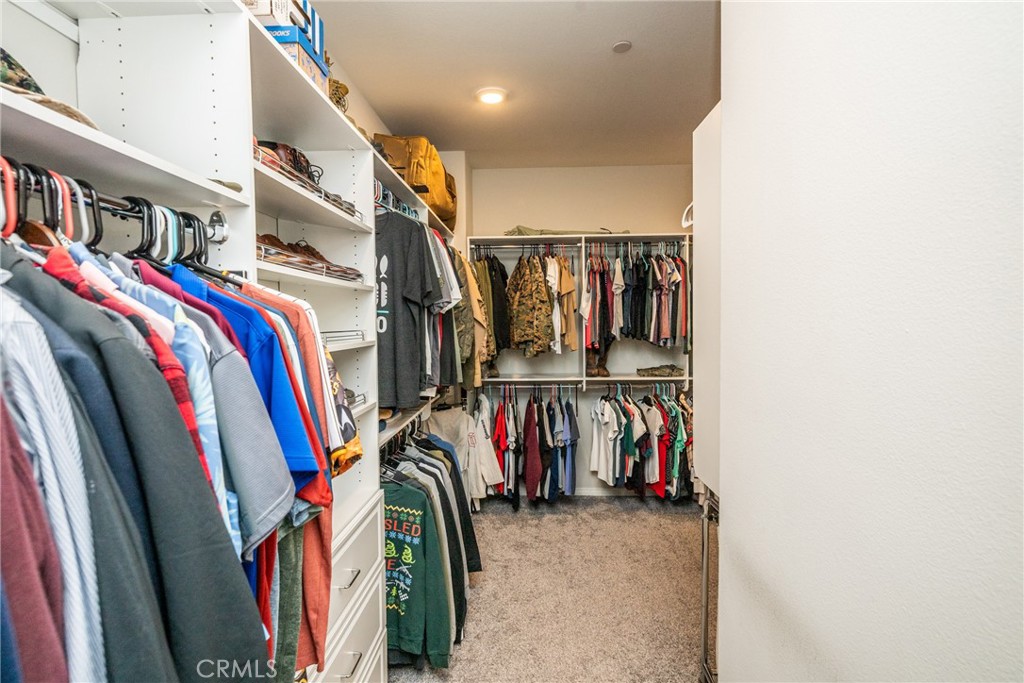 32390 Magee Lane Temecula, CA 92592 - Photo 45 of 75 a view of walk in closet with clothes
