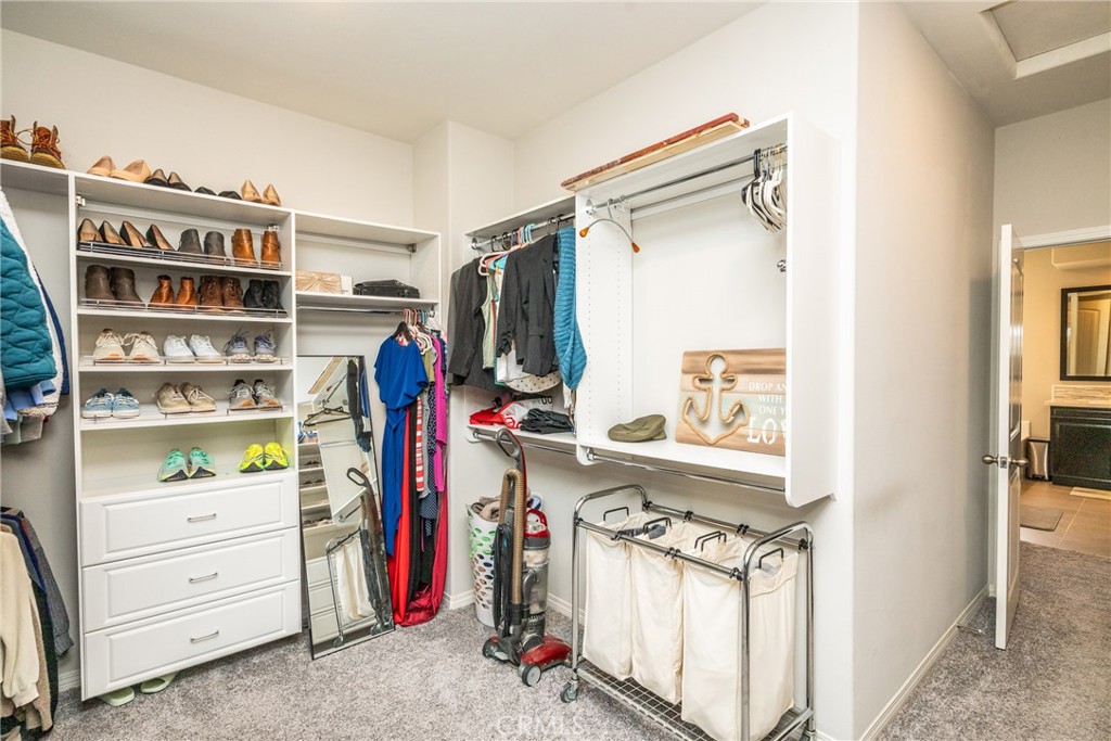 32390 Magee Lane Temecula, CA 92592 - Photo 46 of 75 a view of walk in closet with clothes and shoes