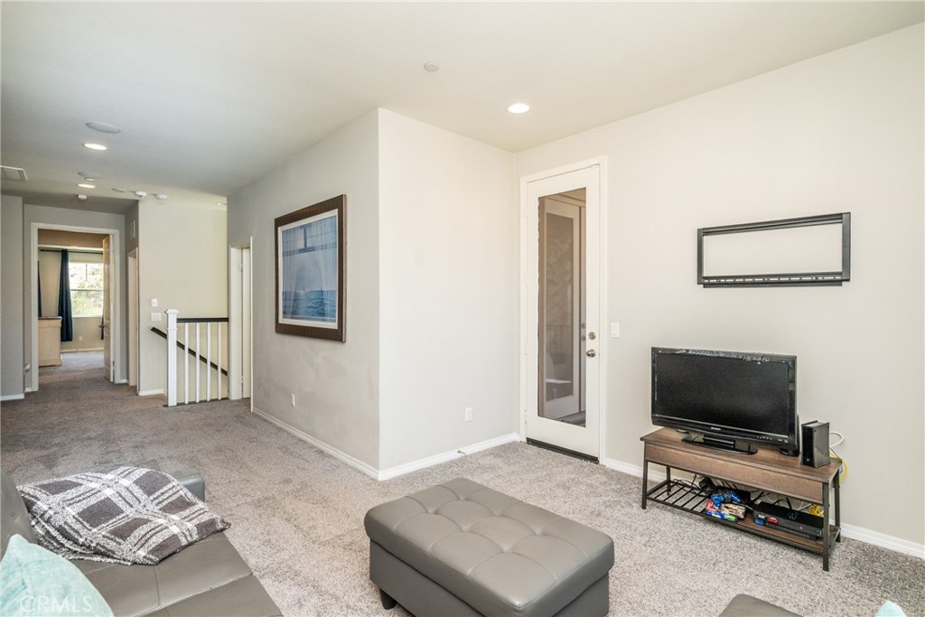 32390 Magee Lane Temecula, CA 92592 - Photo 50 of 75 a living room with furniture and a flat screen tv