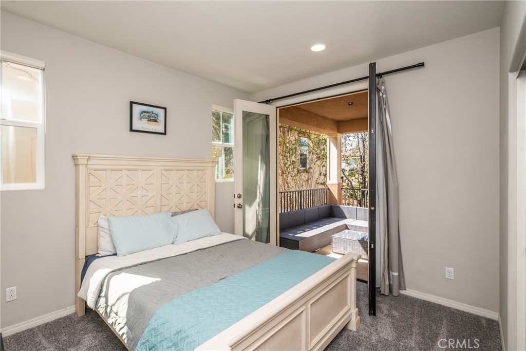 32390 Magee Lane Temecula, CA 92592 - Photo 56 of 75 a bedroom with a bed and wooden floor