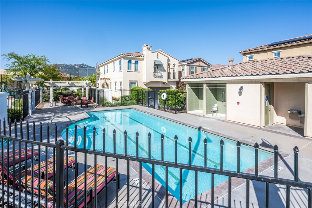 32390 Magee Lane Temecula, CA 92592 - Photo 69 of 75 a view of a white building with a flower garden