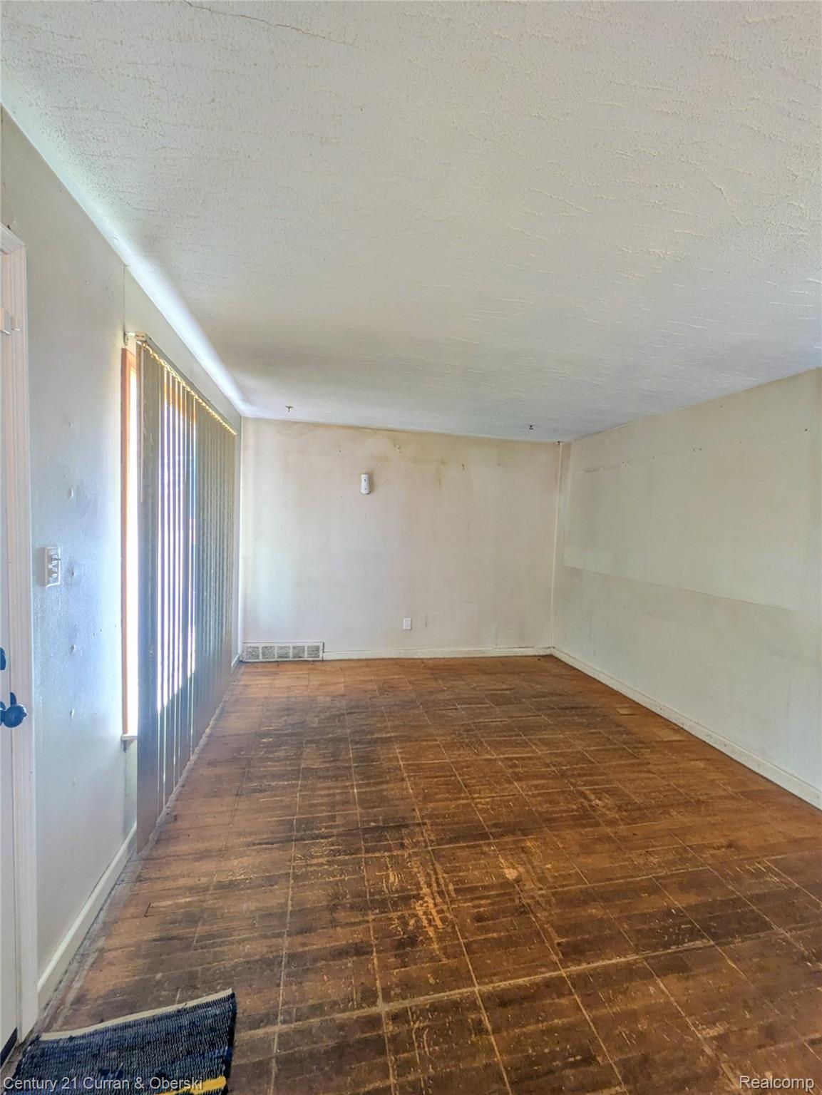 26872 Colgate Street Inkster, MI 48141 - Photo 3 of 9 Unfurnished room with a textured ceiling and baseboards