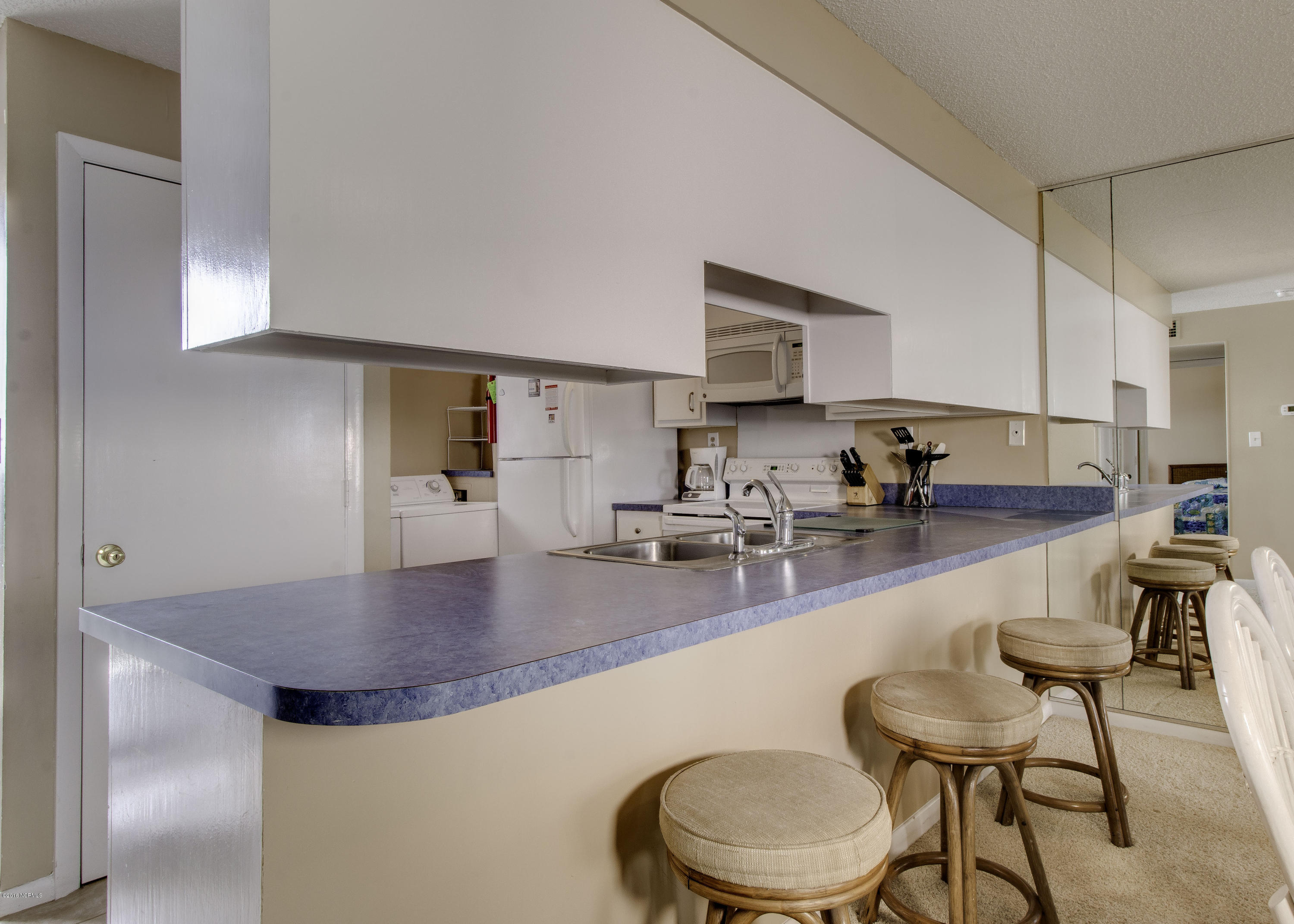 1505 Salter Path Road, Unit 533 Indian Beach, NC 28512 - Photo 4 of 10 Room for a few more at the kitchen counter.