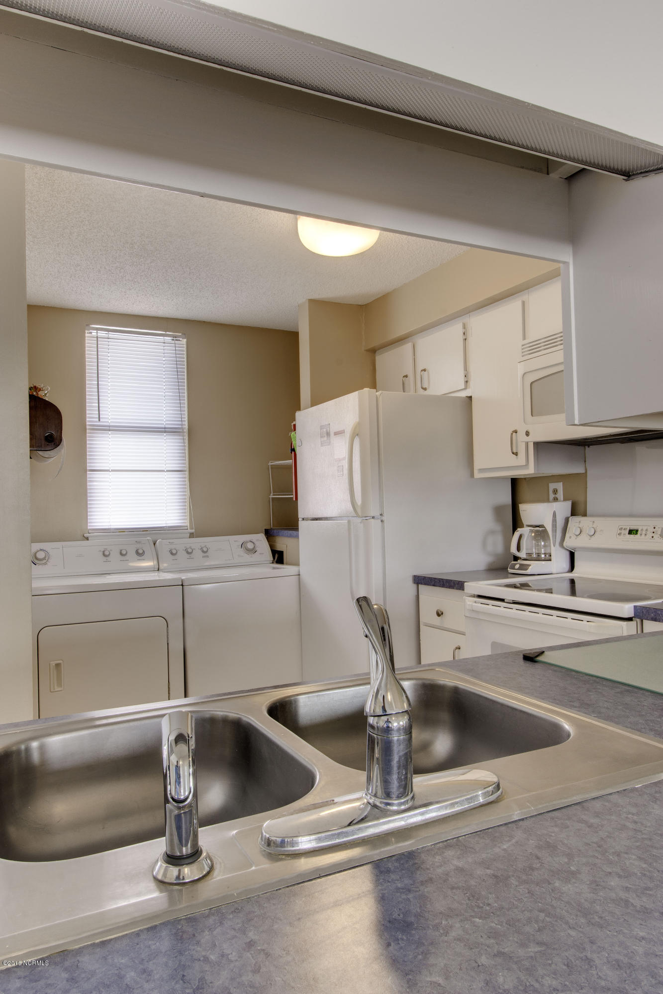 1505 Salter Path Road, Unit 533 Indian Beach, NC 28512 - Photo 5 of 10 Washer/dryer off kitchen