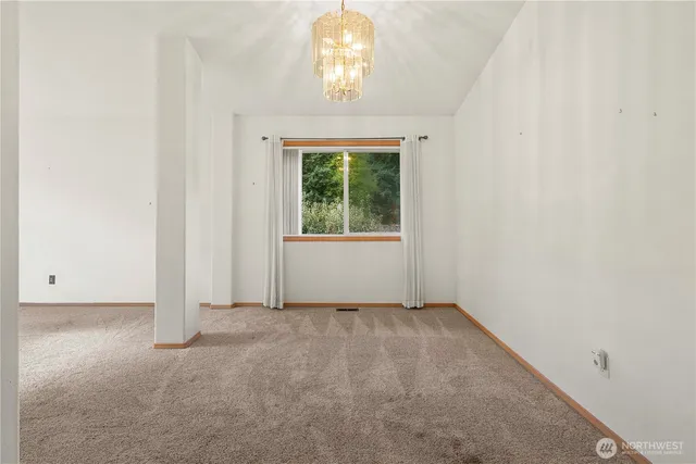 a spacious bathroom with a large tub sink and double vanity