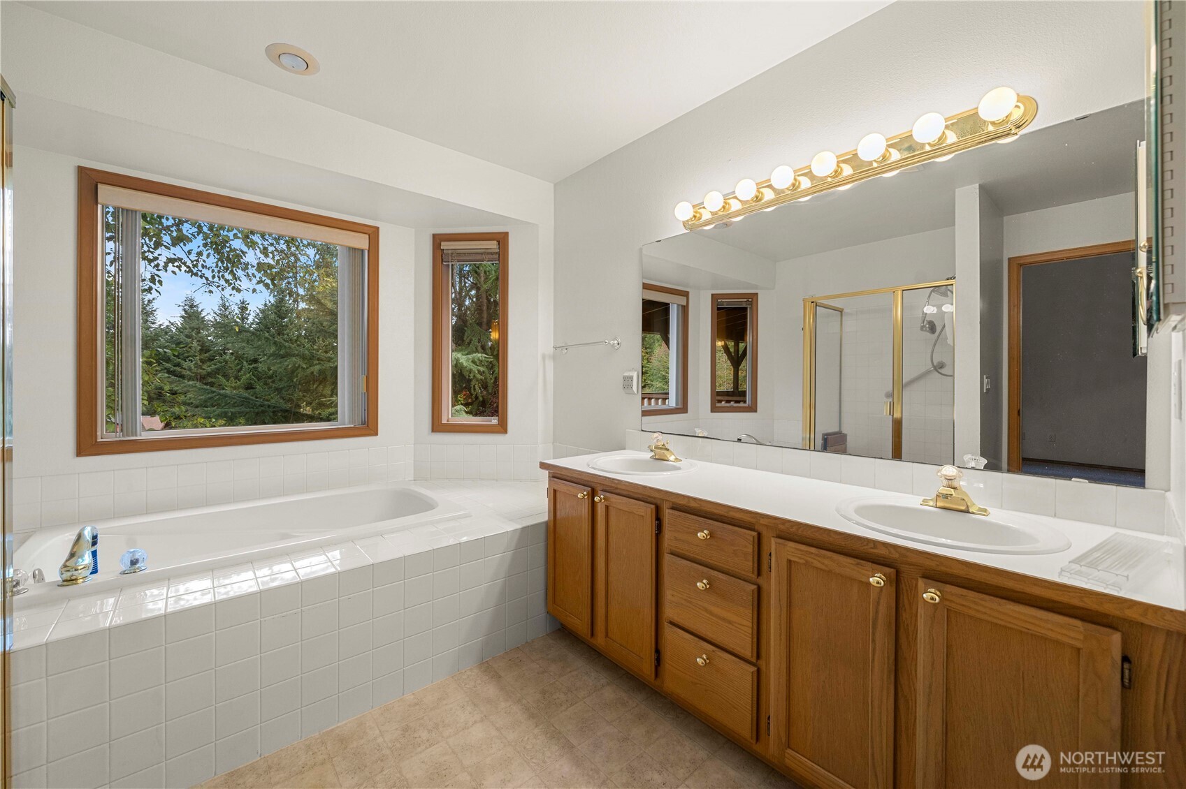 21103 16th Street East Lake Tapps, WA 98391 - Photo 16 of 30 a spacious bathroom with a large tub sink and double vanity