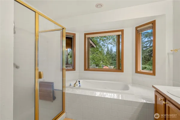 a large kitchen with stainless steel appliances granite countertop a stove and a sink